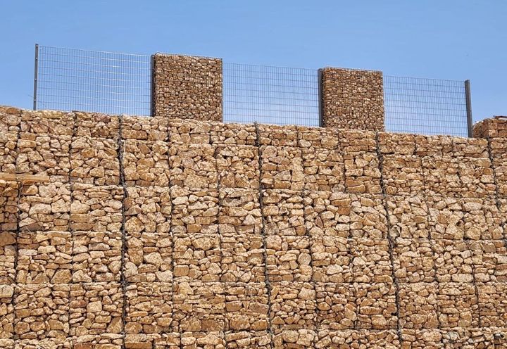 Weldmesh barrier above Terramesh MSE wall