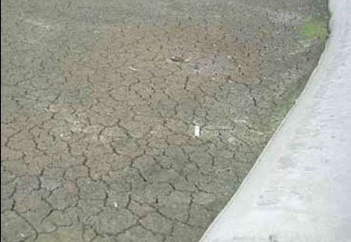 Dewatered dredge spoil material