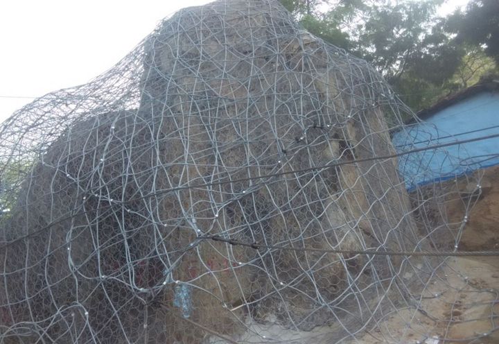 Figure 3- Boulder covered with the meshes and wire ropes anchored with nails