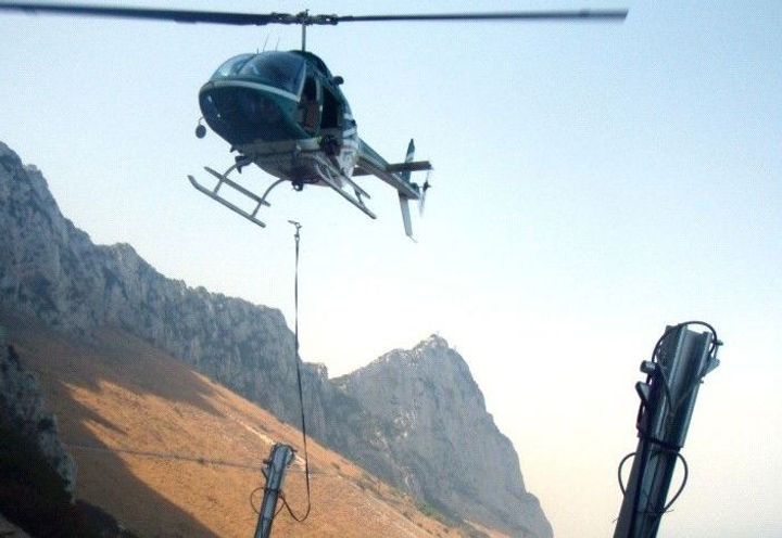 Using helicopters to lift posts into position