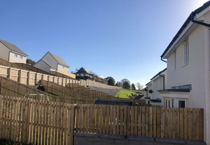 Retaining wall around the housing development