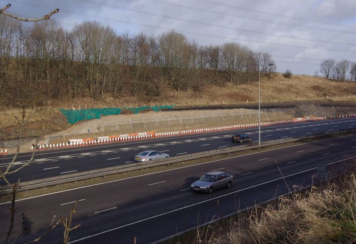 During construction showing cut slope behind