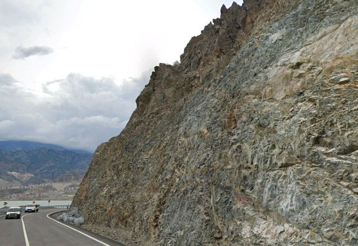 Steep slope outcrop view before drapery system