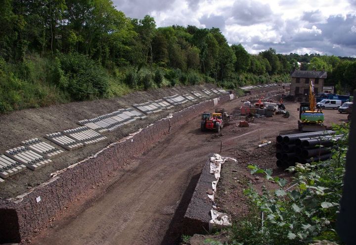 Completed retaining structure and railway line in Catcune