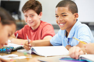Students Taking Notes In Classroom