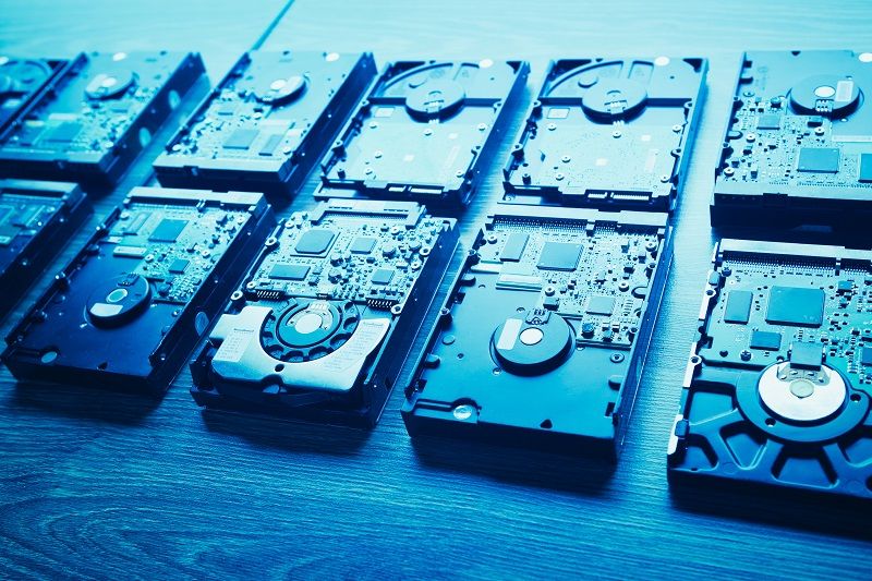 hard disk drives in a rows, blue tone