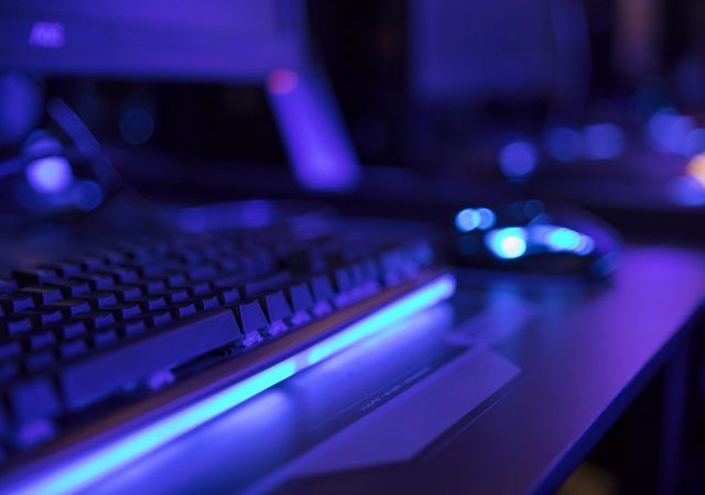 keyboard with mouse on table in gaming arena