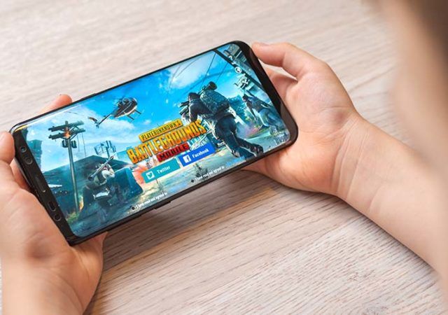 Sarajevo, Bosnia and Herzegovina - November 29, 2019: PlayerUnknown's Battlegrounds or PUBG online multiplayer battle royale game on Samsung Galaxy S9 plus smart phone in boy hands close-up