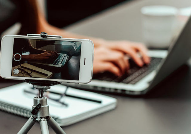 Woman vlogger recording a video.