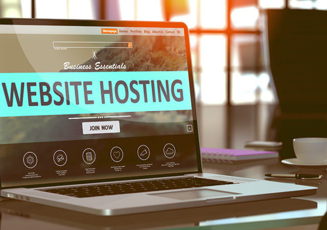 Website Hosting Concept. Closeup Landing Page on Laptop Screen on background of Comfortable Working Place in Modern Office. Blurred, Toned Image. 3D Render.