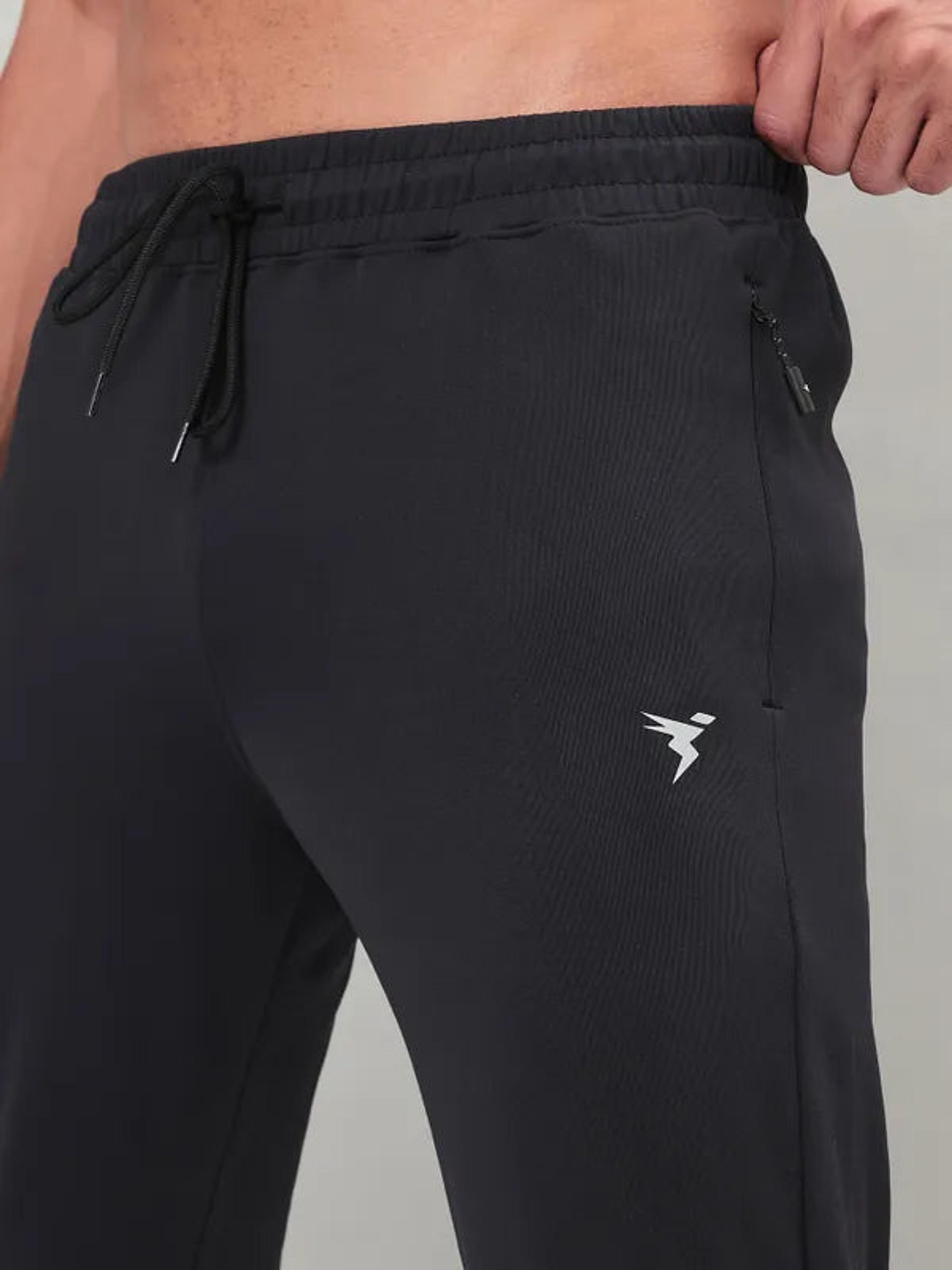 Men Solid Slim Fit Trackpants with ELASTO PLUS in Black - 7
