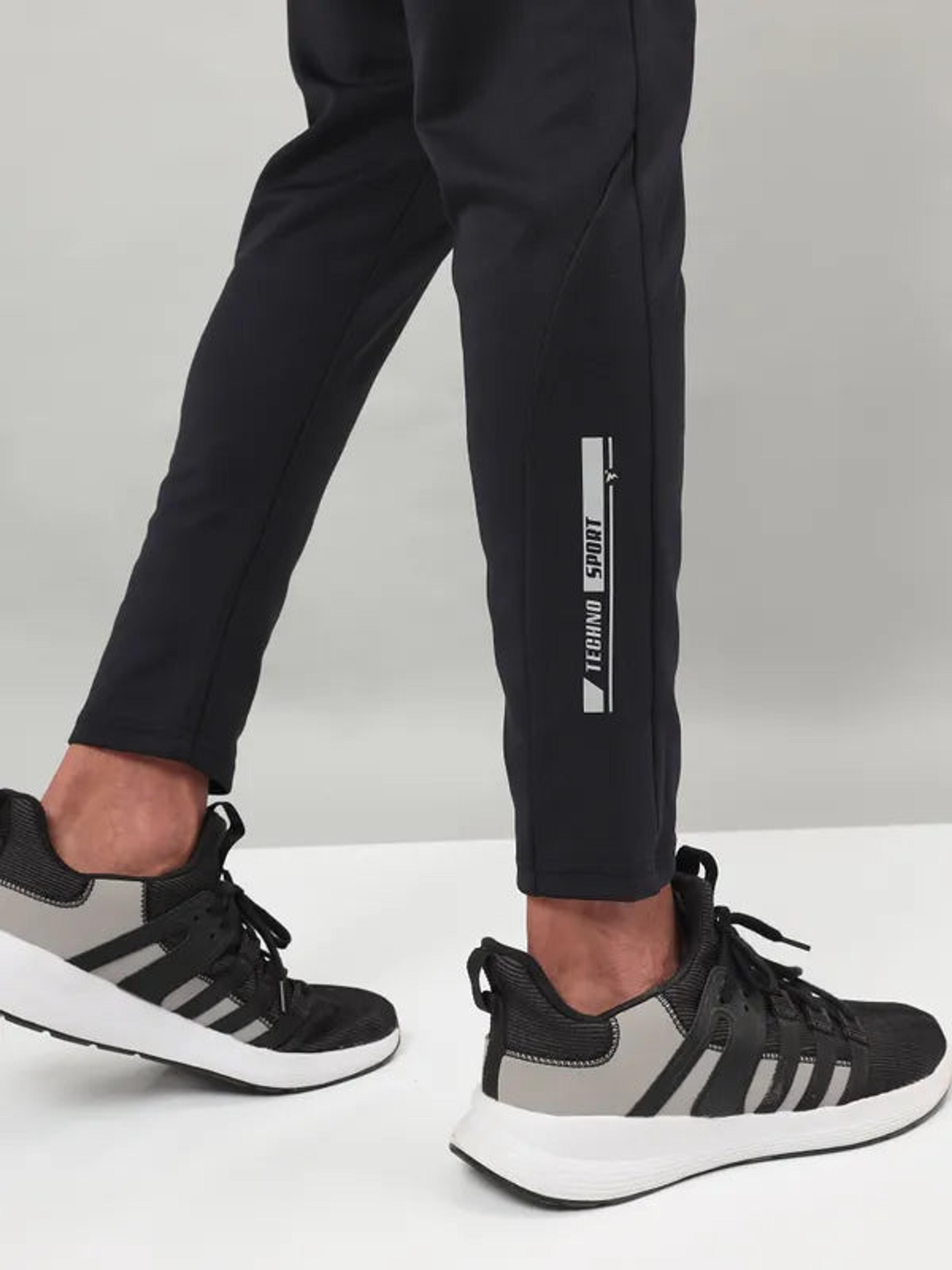 Men Solid Slim Fit Trackpants with ELASTO PLUS in Black - 8