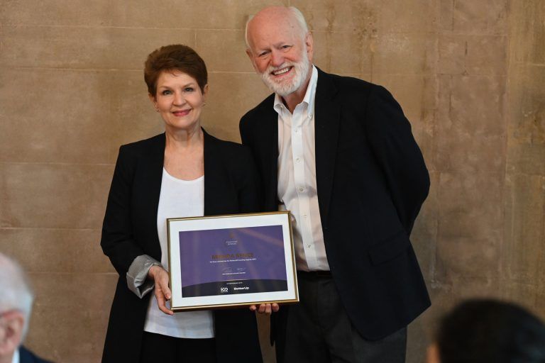 Brenda Bence accepting her Thinkers50 Coaching Legends certificate