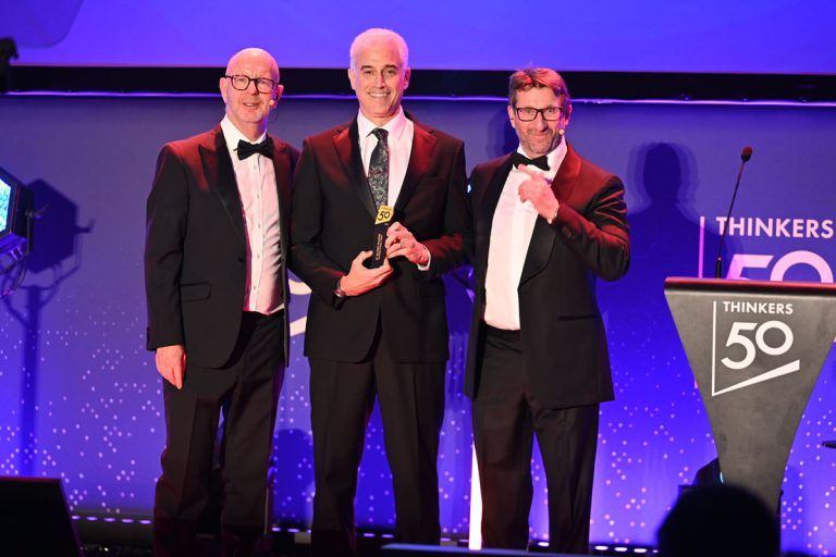 Andrew Winston accepting the Thinkers50 #1 Ranking trophy (with Paul Polman)