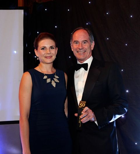 Roger Martin accepts the 2013 Best Book Award from Nicole Eggleton of Pearson