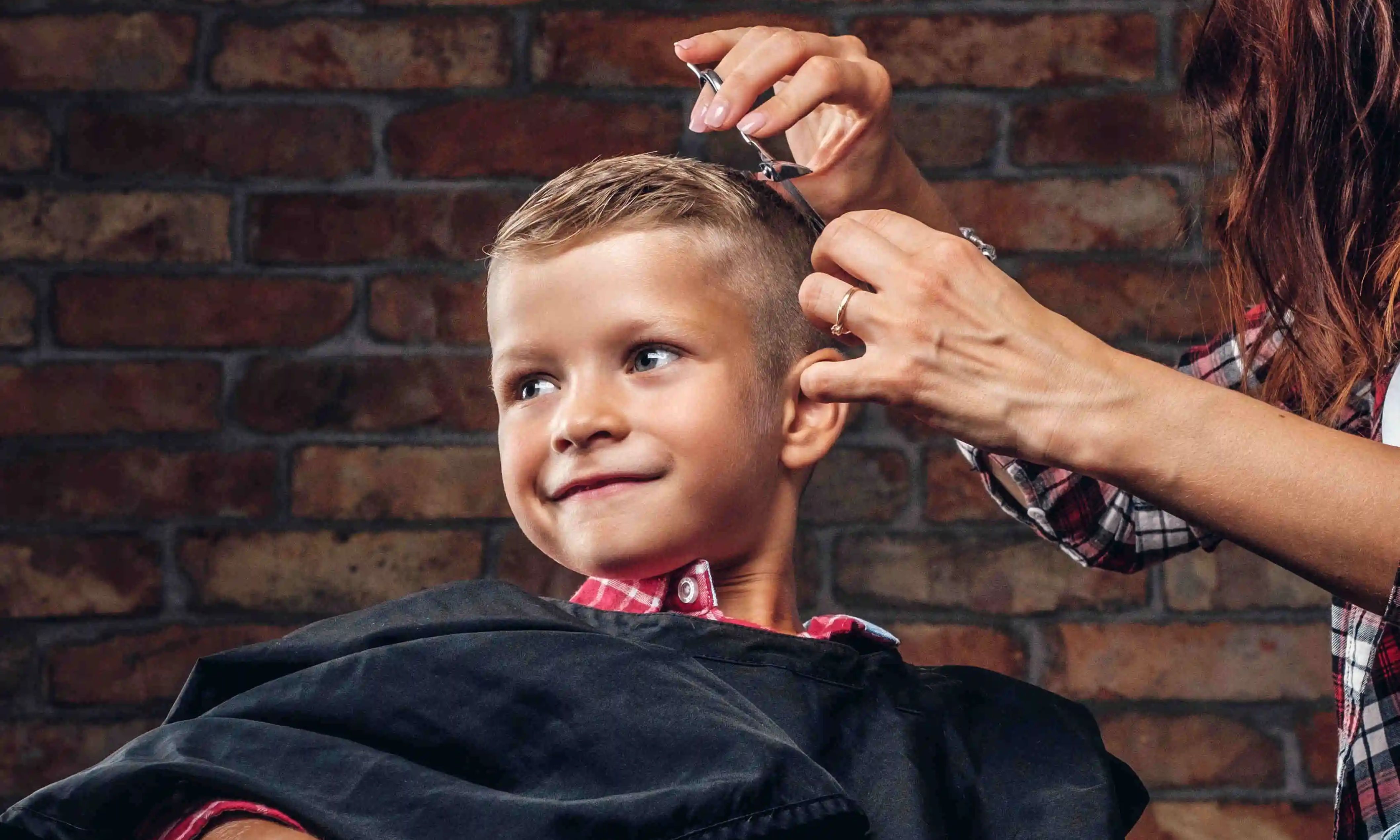 Kid’s haircut service at home with a clean and safe grooming setup.