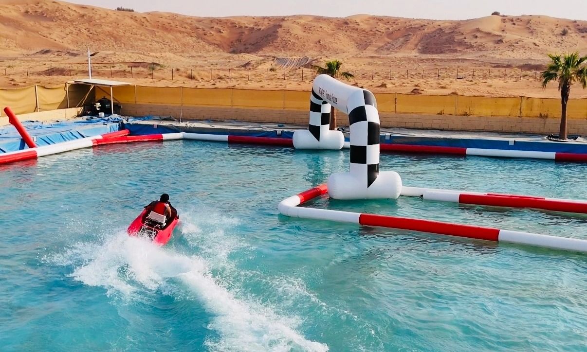 Tourists experiencing Dubai’s exclusive desert jet ski ride with open desert breeze.