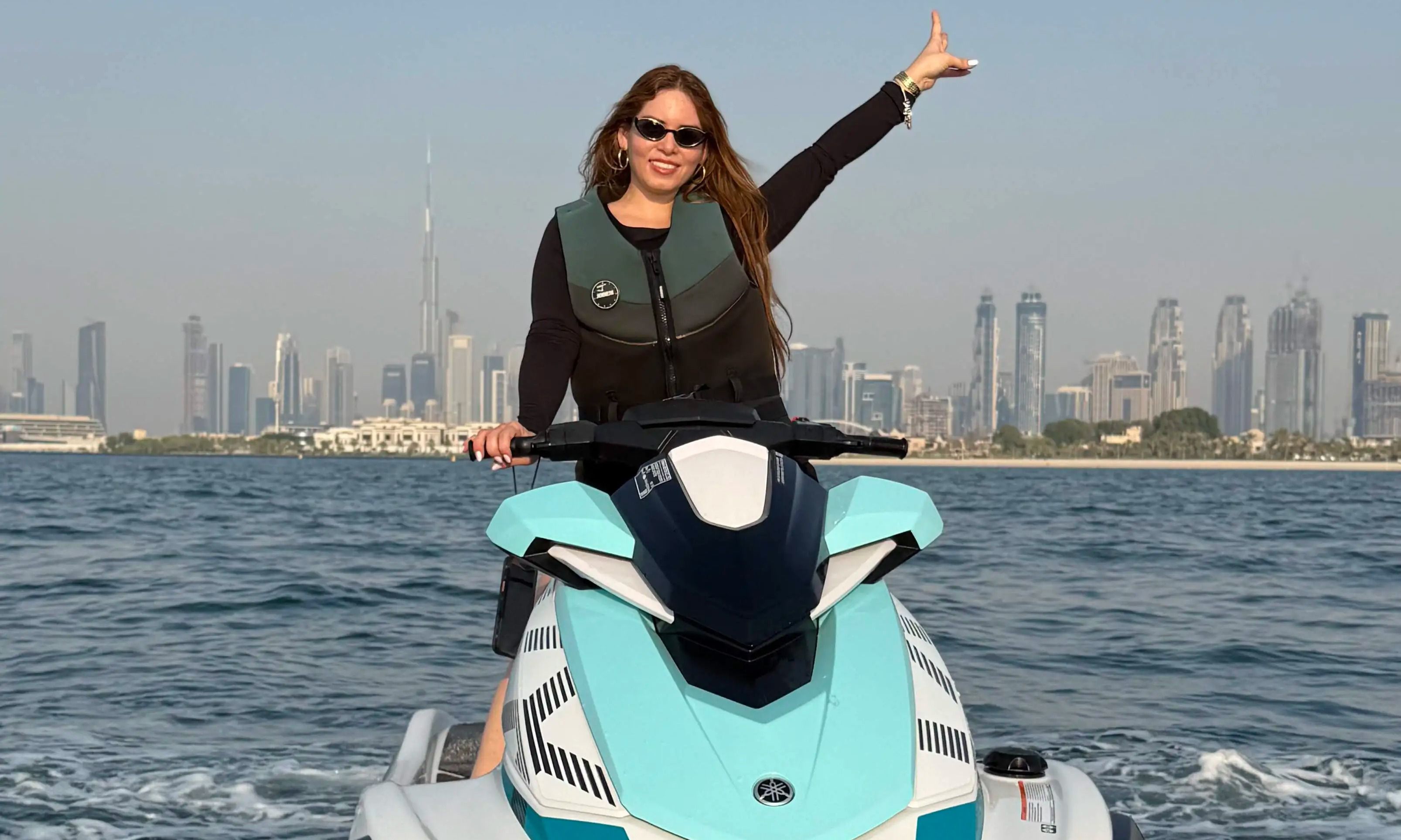 Jet ski experience in Dubai with clear blue waters and Burj Khalifa visible in the distance.
