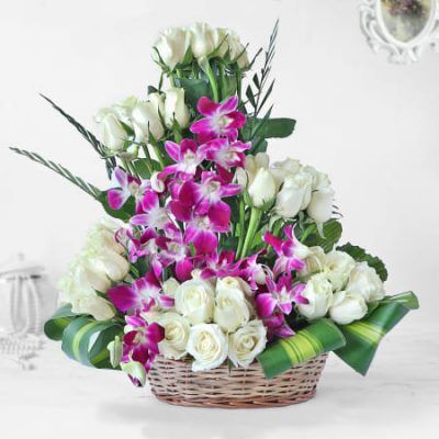 p-white-roses-and-orchids-in-cane-basket-112360-m[1]