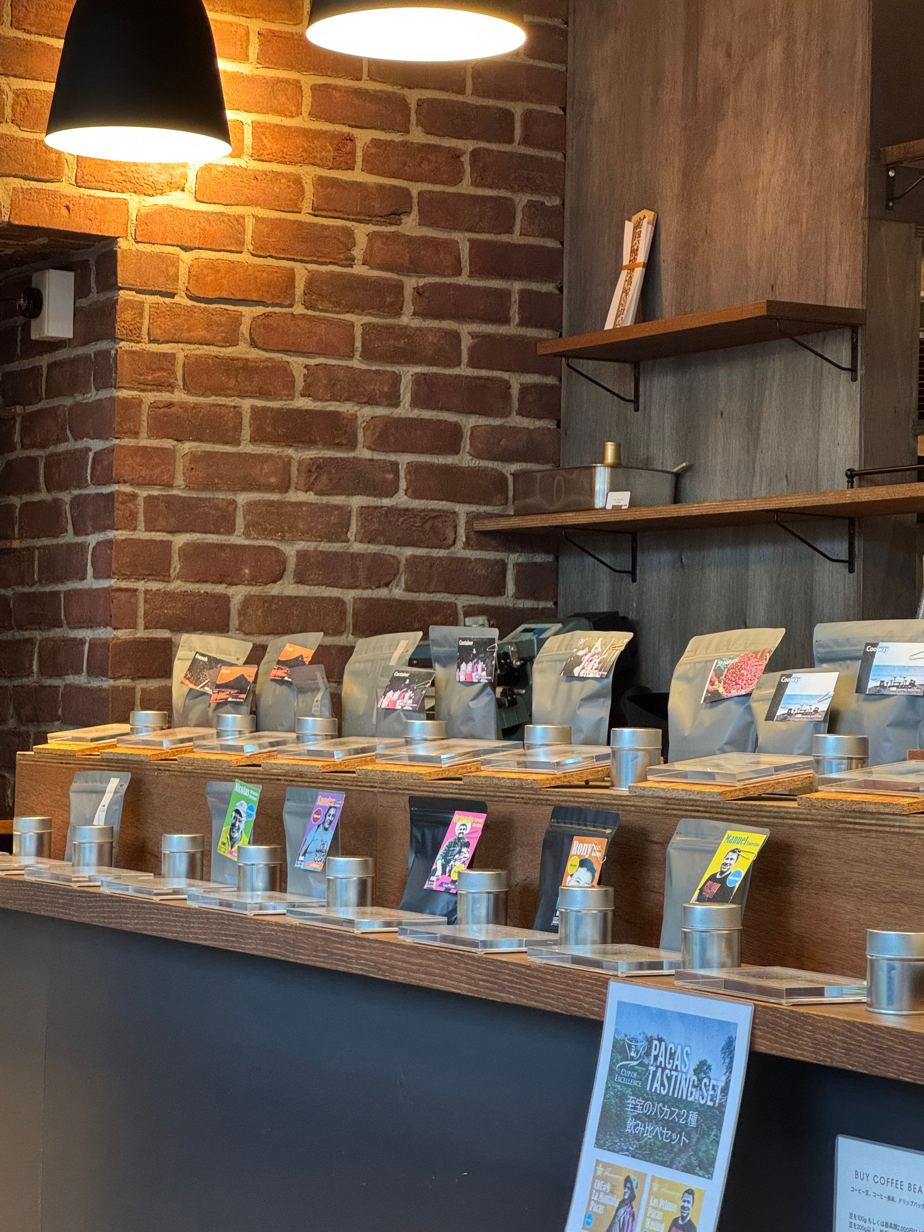 inside the coffee shop 27 coffee roasters displaying an array of selections of coffee beans sold on site