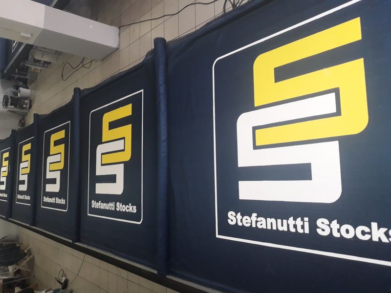 Printed shadenet fence branding on a construction site