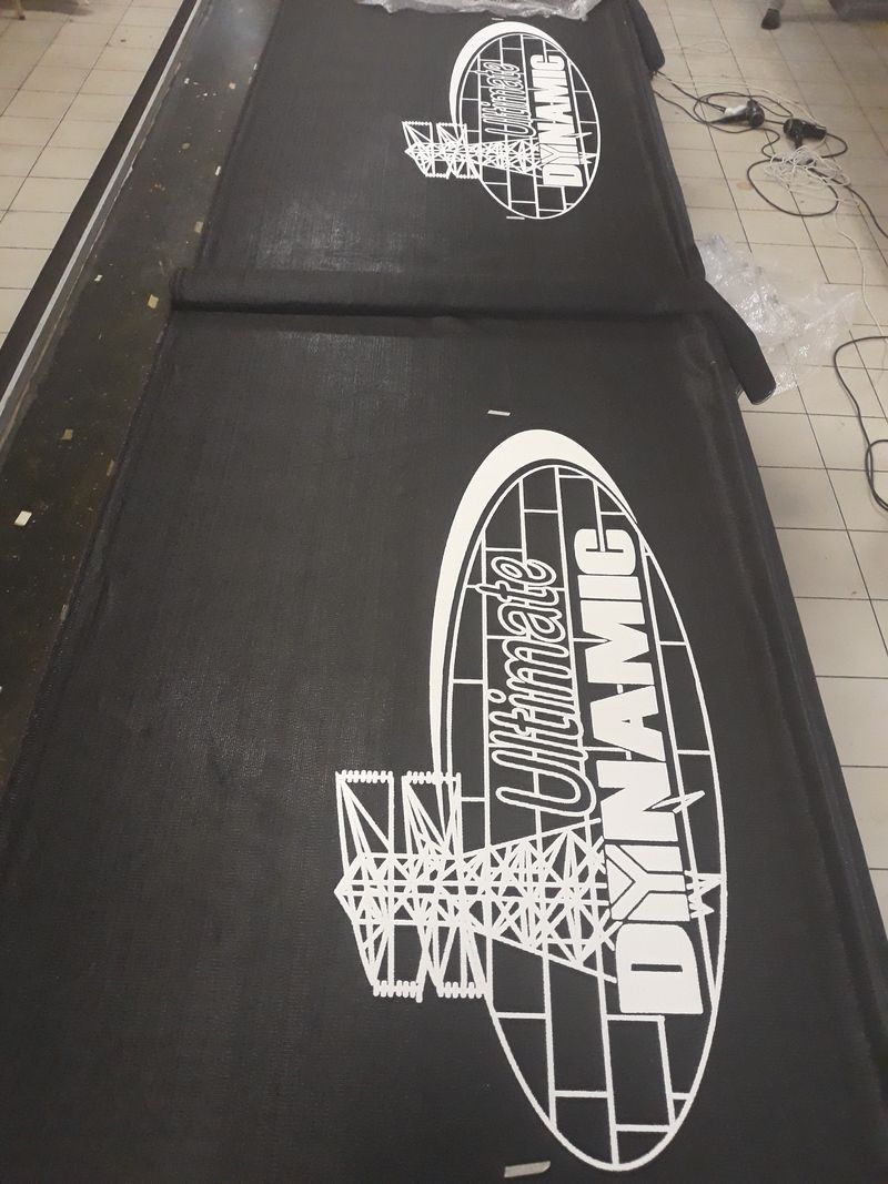 Large printed shadenet banner on construction fencing