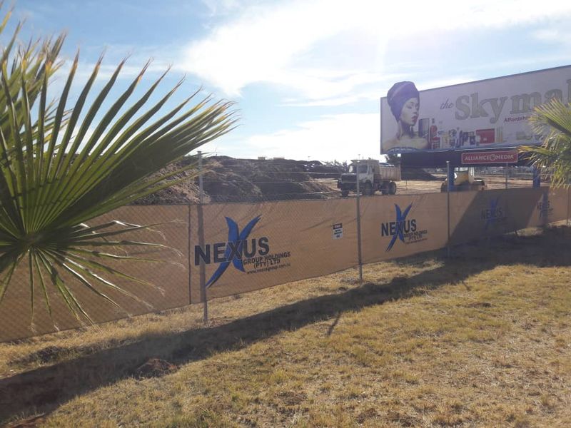 Branded shadenet barrier around a building site