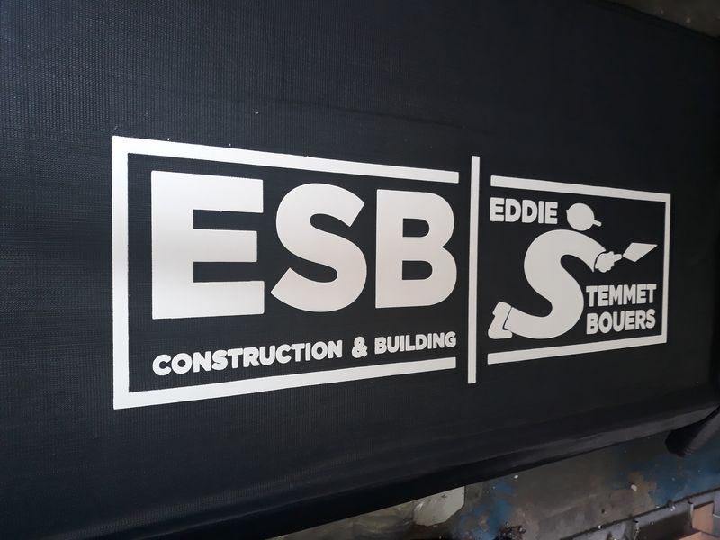 Printed shadenet branding on a city construction site