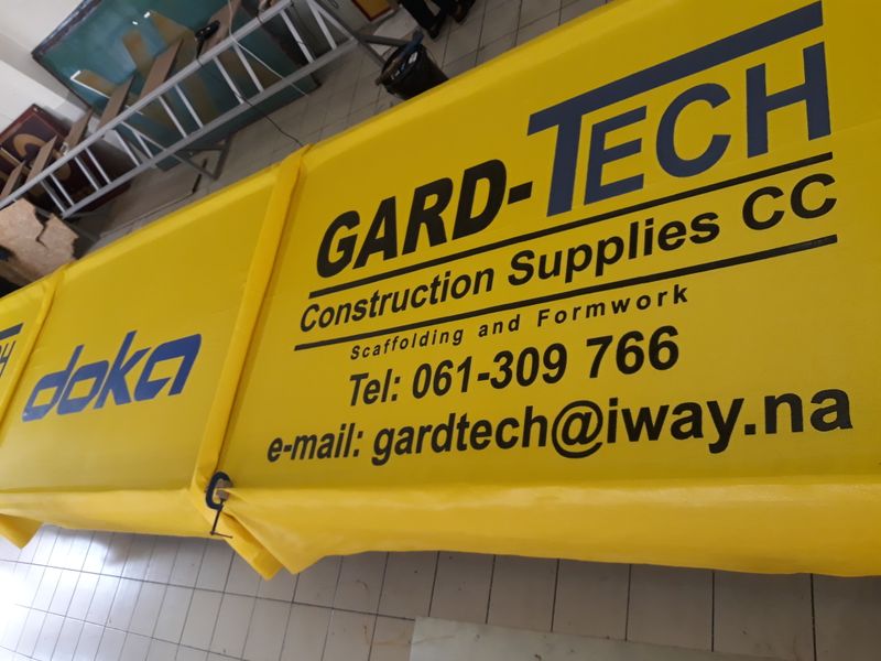 Branded logo print on construction site shadenet