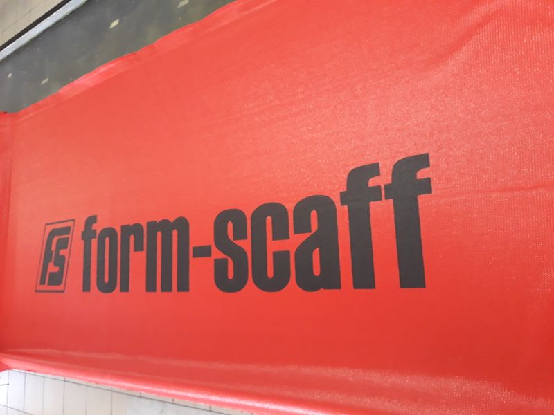 Site hoarding branded with printed shadenet