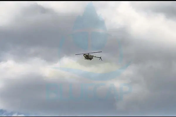 BlueCapHeli® in controlled flight with survey equipment