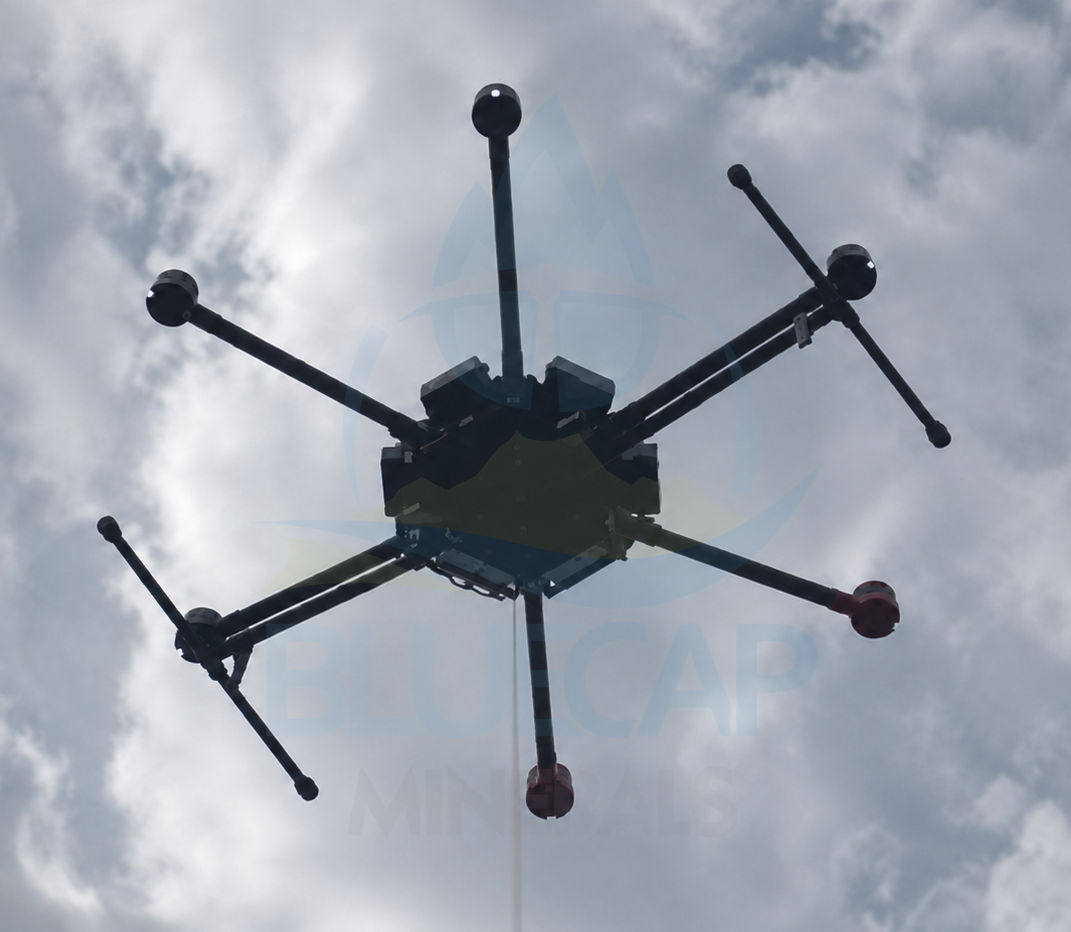 BlueCap-operated DJI Matrice 600 Pro in flight carrying survey equipment