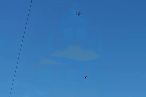 BlueCapBird® Fast suspended beneath BlueCapHeli® during terrain-following acquisition