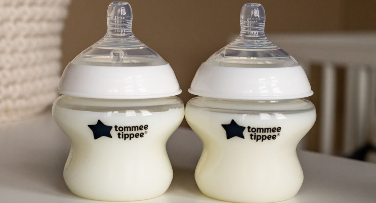 2 Natural start bottles on countertop containing milk