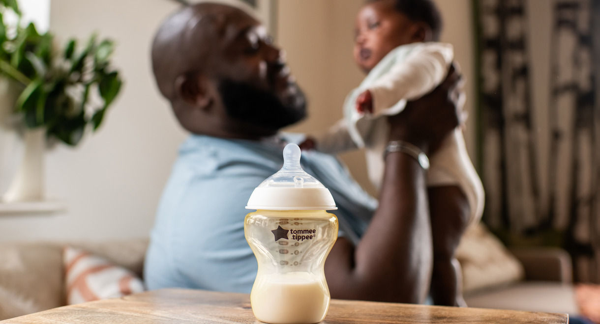 Mother feeding baby milk with Natural Start PPSU bottle