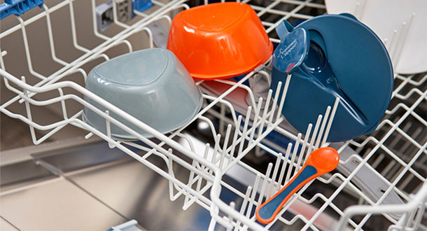 Cutlery and tableware placed into washing machine