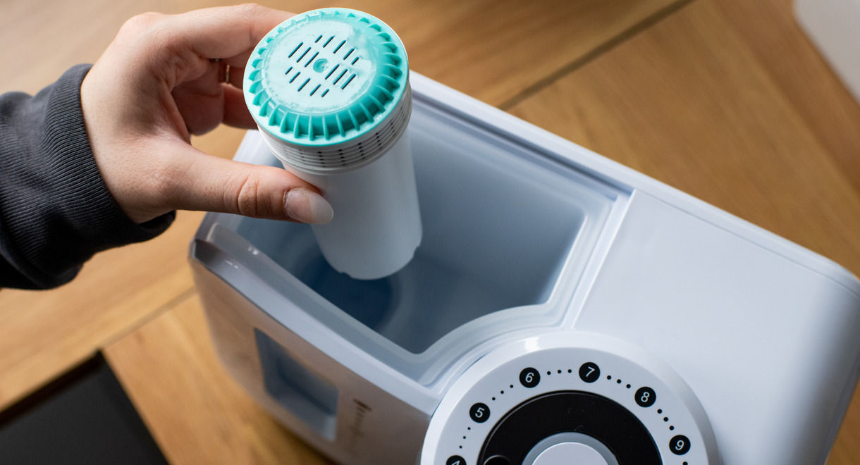 Women placing Perfect Prep filter into Perfect prep oringal machine 