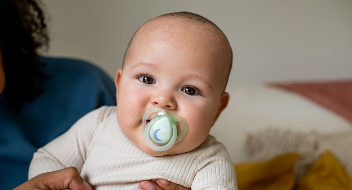 Baby sucking on Night time soother