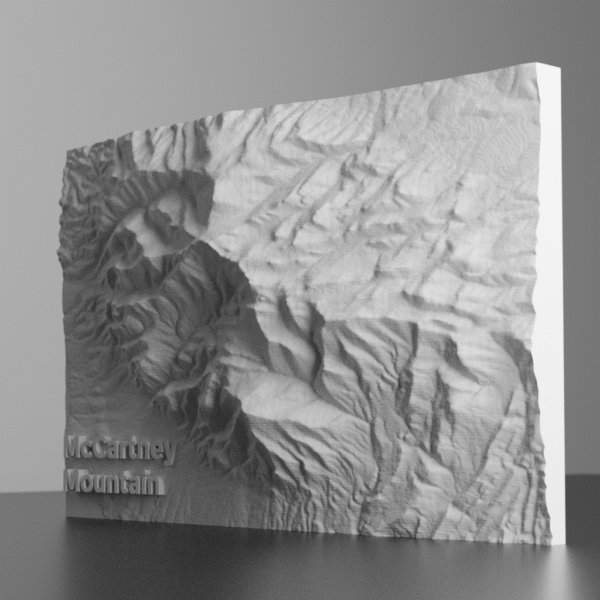 3D terrain rendering of McCartney Mountain, Montana, showing detailed ridgelines, steep slopes, and surrounding foothills based on USGS elevation data.