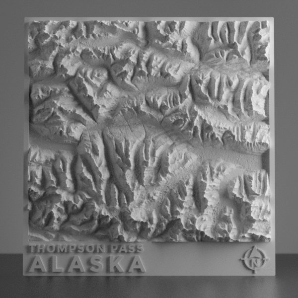 3D terrain model of Thompson Pass, Alaska showing snow-covered mountain ridges, deep valleys, and backcountry terrain shaped by high-resolution elevation data.