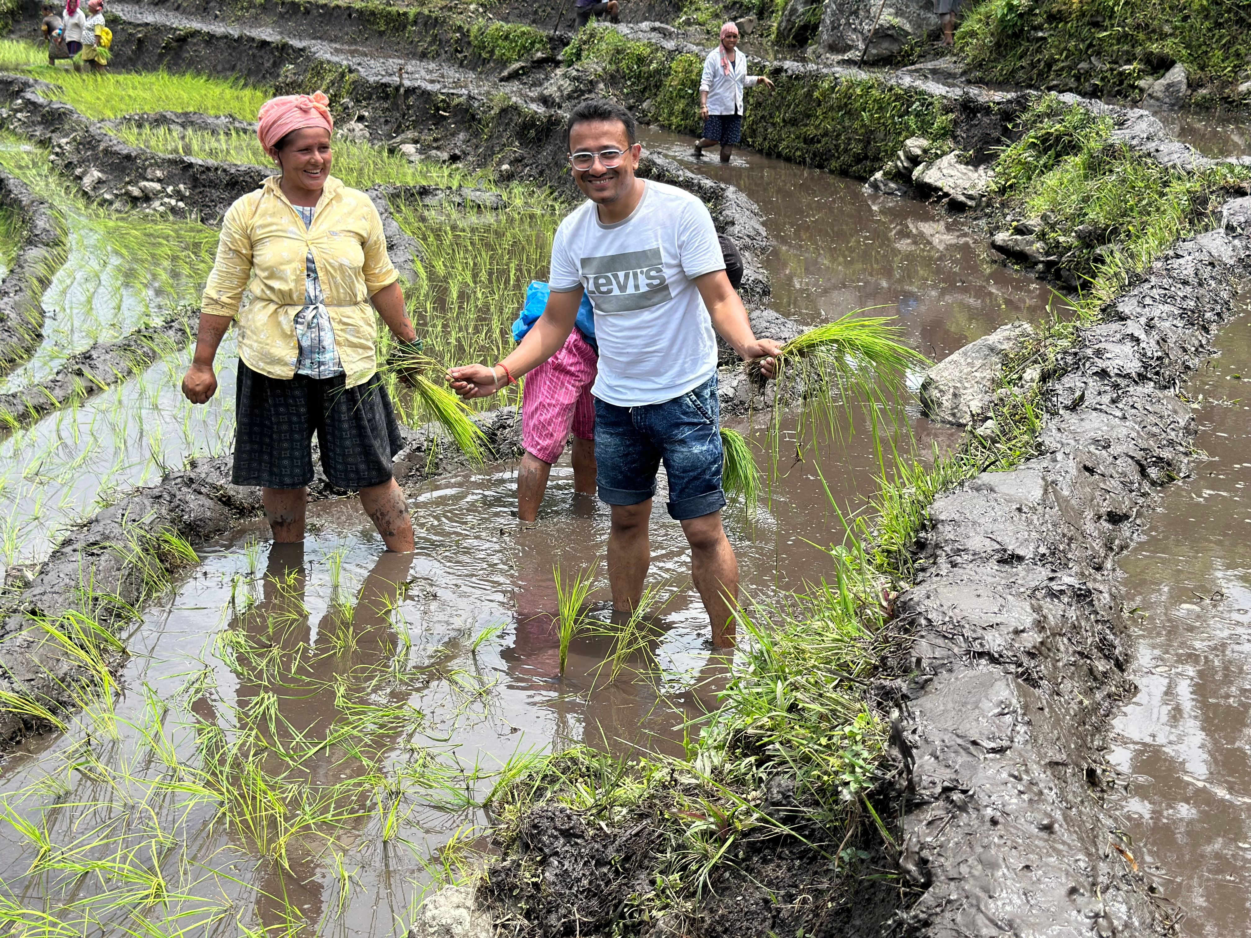 Local Himalayan woman showing farming method to visitors