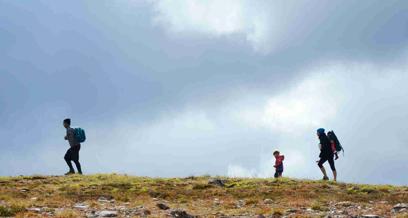 Family hiking in the mountains near Smithers