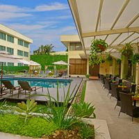 Covered terrace and outdoor siwming pool.