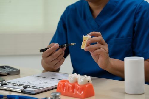 Doctor explaining wisdom tooth removal Doctor explaining wisdom tooth problems, reasons for tooth extraction and procedure and process at onehunga dentist, dental clinic