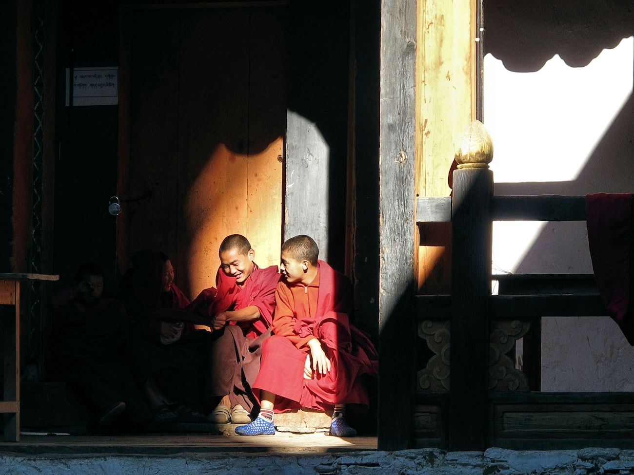 Young Bhutanese monks sharing a laugh