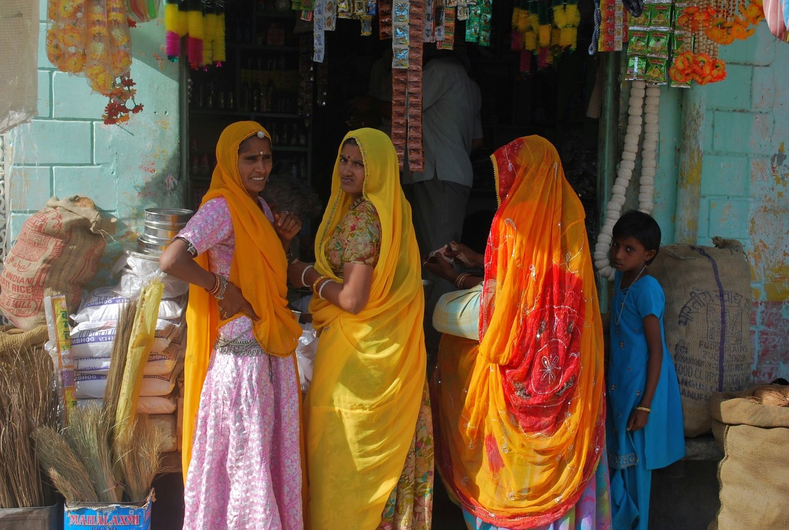 Three women at a kirana (grocery) shop in an Indian village