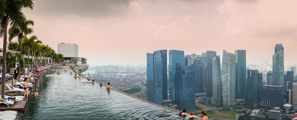 Share cocktails at Marina Bay Sands rooftop
