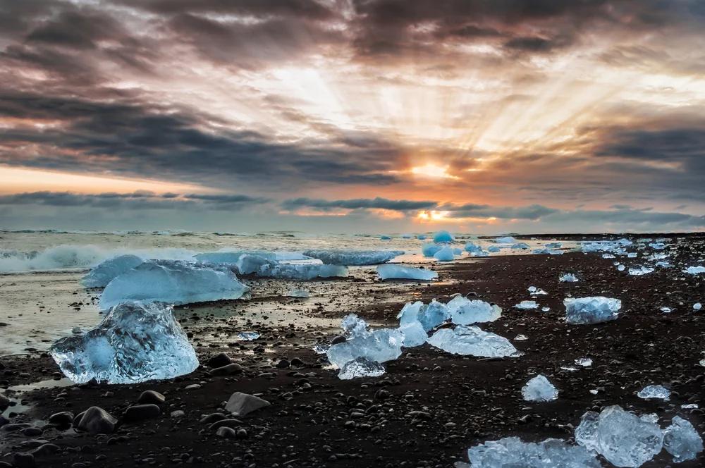 Walk along Diamond Beach at sunrise