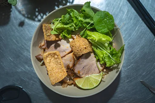 Try regional dishes like Cao Lầu in Hội An