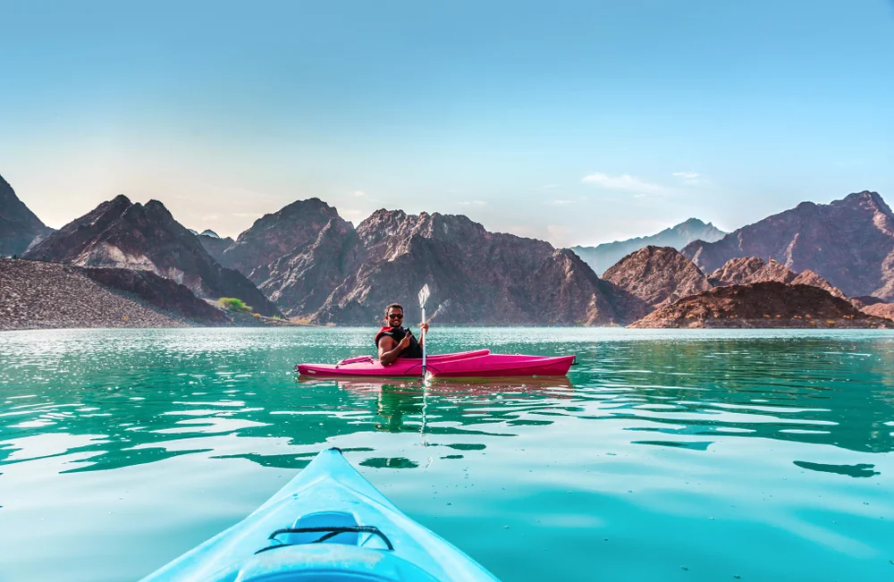 Kayak through the serene waters of Hatta Dam